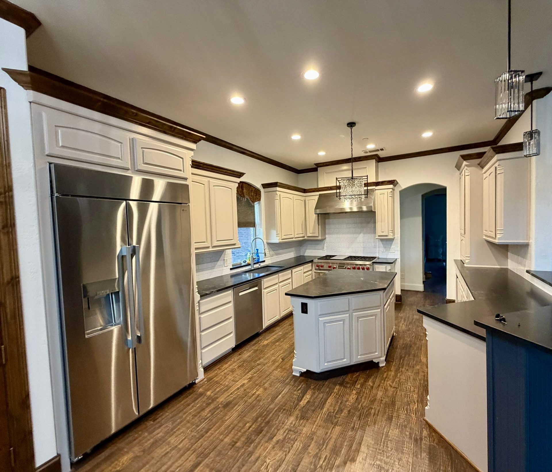 Kitchen cabinets painted and refinished in white by San Miguel Painting in Dallas, Texas