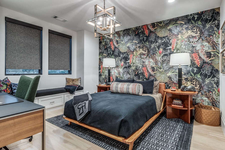 Bedroom with white walls and a dark tropical print accent wall, interior project by San Miguel Painting in Dallas, Texas