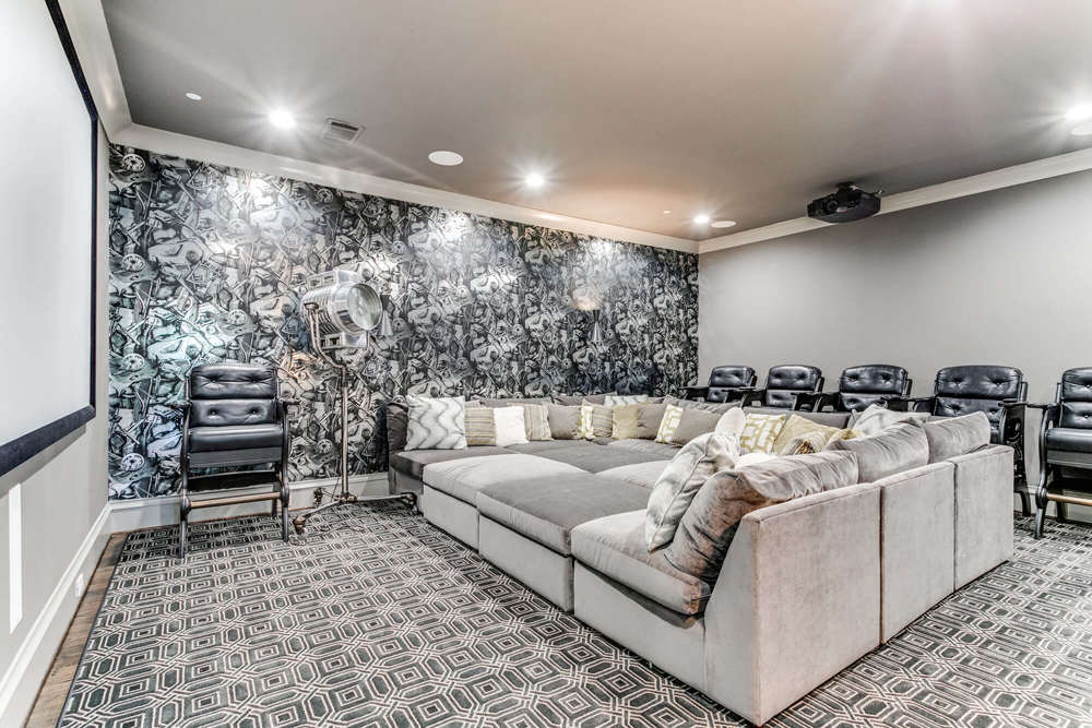 Media room with light gray walls, white trim and a bold black floral accent wall, San Miguel Painting project in Dallas, Texas